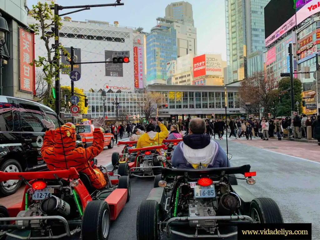 Waiting at the famous Shibuya Crossing in our Mario go karts at Tokyo, Japan